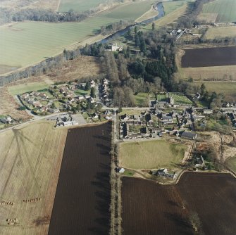 Oblique aerial view centred on Monymusk village with the tower-house in the background, taken from the WSW.