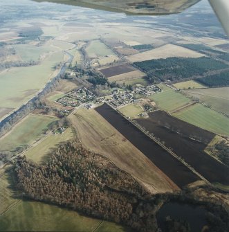 General oblique aerial view centred on Monymusk village, taken from the NW.