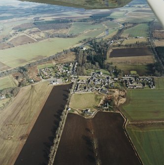 General oblique aerial view centred on Monymusk village, taken from the WSW.