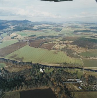 General oblique aerial view looking across Monymusk House towards Bennachie, taken from the S.