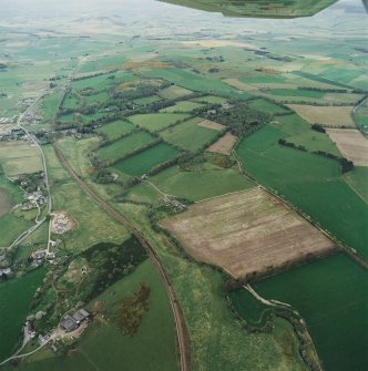 Oblique aerial view of tower-house, country house, home farm and policies, taken from the ESE.