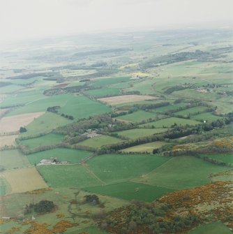 Oblique aerial view of tower-house, country house, home farm and policies, taken from the WNW.