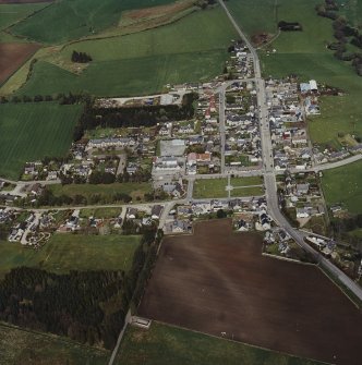 Oblique aerial view of Rhynie centred on the church, taken from the SW.