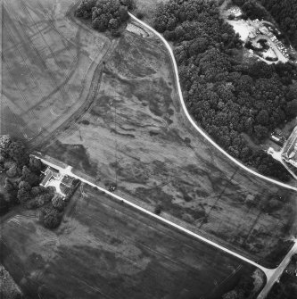 Aerial view from South West showing Gordon Castle laundry cottages, saw mill and cropmarks