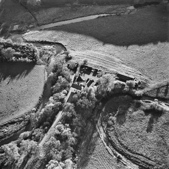 Oblique aerial view centred on the tower-house, taken from the NNE.