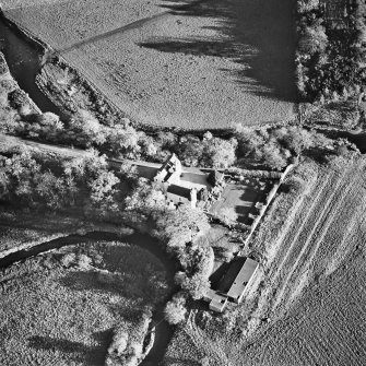 Oblique aerial view centred on the tower-house, taken from the NW.