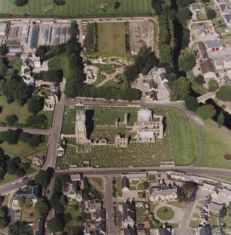 Oblique aerial view centred on the remains of the cathedral and Chapter House, taken from the S.