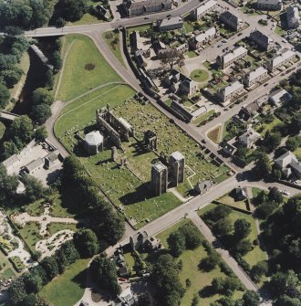 Oblique aerial view centred on the remains of the cathedral and Chapter House, taken from the WNW.