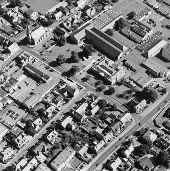 Oblique aerial view centred on the college with the church adjacent, taken from the WNW.