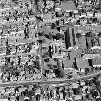 Oblique aerial view centred on the college with the church adjacent, taken from the WSW.