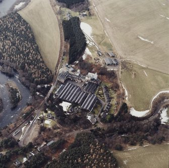 Oblique aerial view centred on the whisky distillery, taken from the NE.