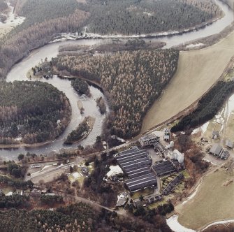 Oblique aerial view centred on the whisky distillery, taken from the NNE.