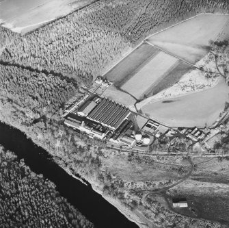 Oblique aerial view centred on the whisky distillery, taken from the SSW.