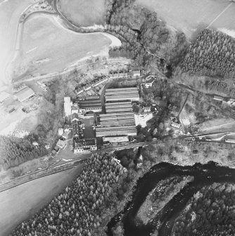 Oblique aerial view centred on the whisky distillery, taken from the S.