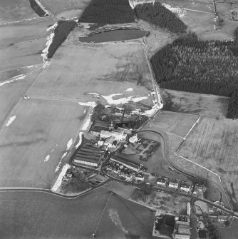 Oblique aerial view centred on the whisky distillery, taken from the S.