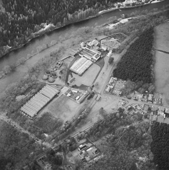 Oblique aerial view centred on the whisky distillery, taken from the ENE.