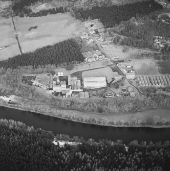 Oblique aerial view centred on the whisky distillery, taken from the SSW.