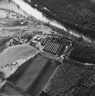 Oblique aerial view centred on the whisky distillery, taken from the NNE.