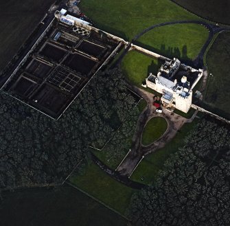 Oblique aerial view centred on the castle and walled garden, taken from the SSE.