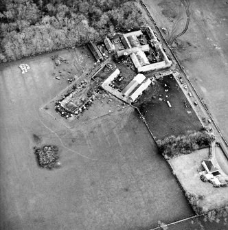 Oblique aerial view centred on the farmsteading, taken from the NW