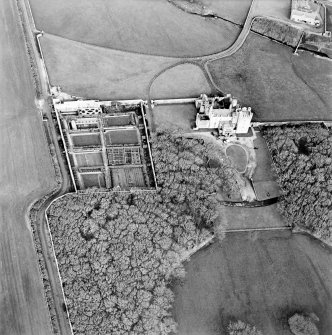 Oblique aerial view centred on the castle and walled garden, taken from the S.