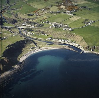 General oblique aerial view of Dunbeath centred on the harbour, taken from the S.