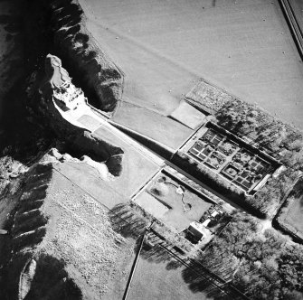 Oblique aerial view centred on the country house, walled gardens and pavilion, taken from the N.