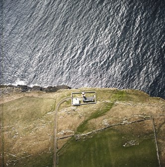 Oblique aerial view centred on the lighthouse, taken from the NW.