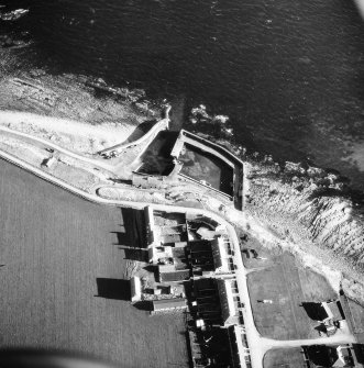 Aerial photograph showing part of village and harbour