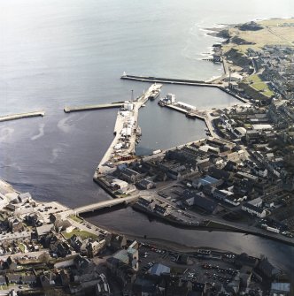Oblique aerial view centred on the harbour, taken from the WNW.