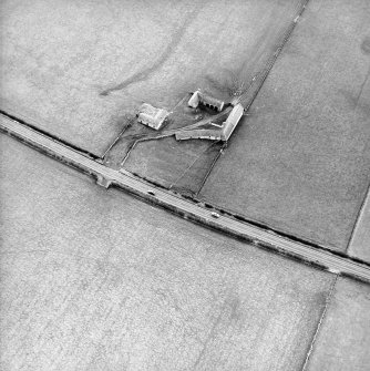 Oblique aerial view centred on the farmsteading, taken from the NE.