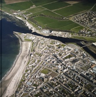 General oblique aerial view of Thurso centred on the harbour and church with the castle adjacent, taken from the W.