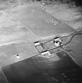 Oblique aerial view centred on the farmstead and mausoleum, taken from the ESE.