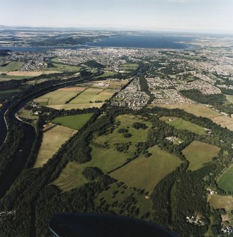 General oblique aerial view looking across the Caledonian Canal and Inverness towards the road bridge and the Moray Firth, taken from the SSW.
