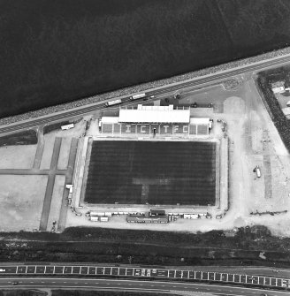 Oblique aerial view centred on the football stadium, taken from the SW.