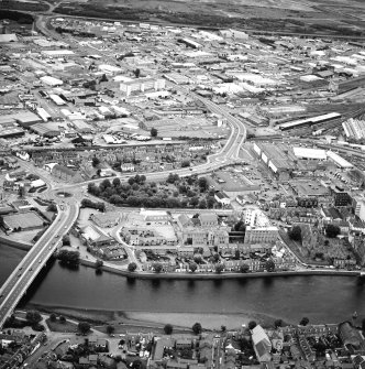 General oblique aerial view of the town, centred on the churches, chapel, burial-ground and road-bridge, taken from the SW.