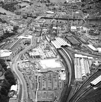 Oblique aerial view centred on the railway station, taken from the NE.
