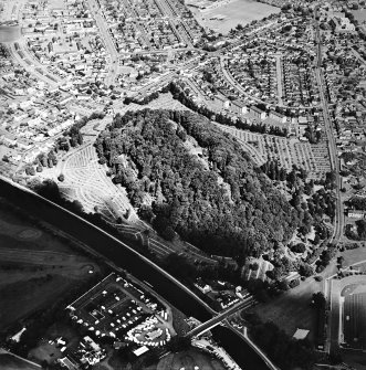 Oblique aerial view centred on the cemetery, with the swing bridge adjacent, taken from the SW.