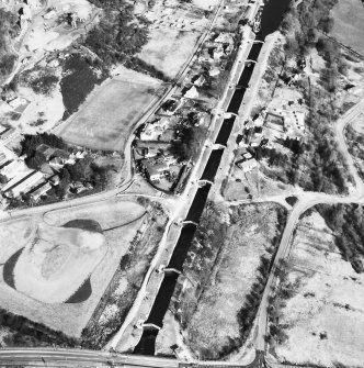 Oblique aerial view showing Neptune's Staircase, Banavie Swing Bridge and Banavie Railway Swing Bridge