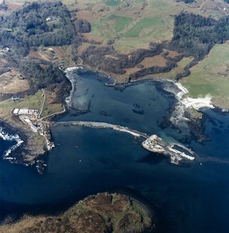 Oblique aerial view centred on the construction of the pier at Galmisdale, taken from the SE.