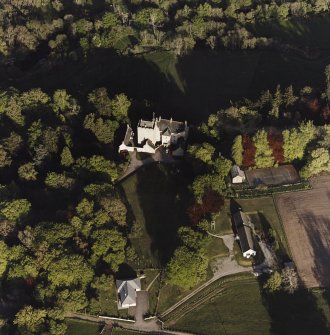 Oblique aerial view of Kilravock Castle and dovecot, taken from the NW.