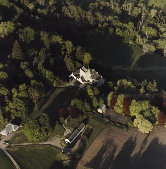 Oblique aerial view of Kilravock Castle and dovecot, taken from the W.