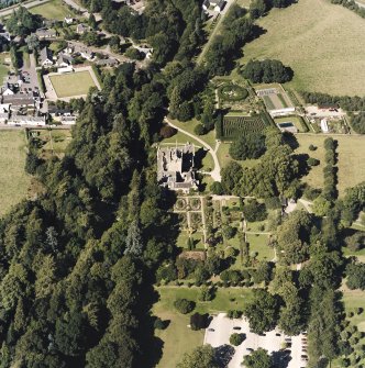 Oblique aerial view centred on the castle and walled garden, taken from the SSE.