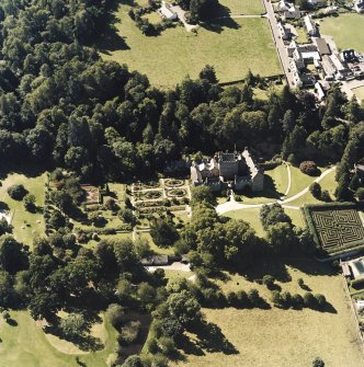 Oblique aerial view centred on the castle and walled garden, taken from the E.