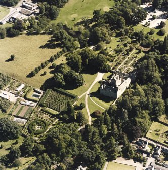 Oblique aerial view centred on the castle and walled garden, taken from the NW.