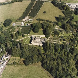 Oblique aerial view centred on the castle and walled garden, taken from the WSW.