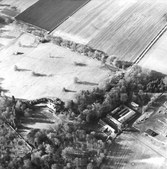 Oblique aerial view centred on the country house, farmsteading and dovecot, taken from the ESE.