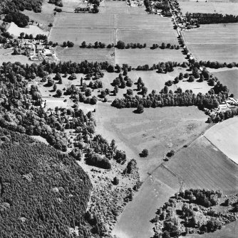 Castle Leod.
Oblique aerial view, taken from the SW, showing the tower-house, a possible golf course and the gate lodge in the centre of the photograph.