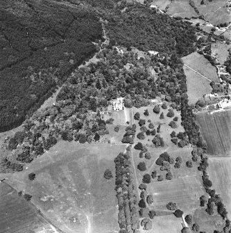 Castle Leod.
Oblique aerial view, taken from the SE, centred on the tower-house. A possible golf course is visible in the bottom left-hand corner of the photograph.