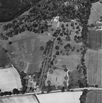 Castle Leod.
Oblique aerial view, taken from the SE, showing the tower-house, a possible golf course and the gate lodge.